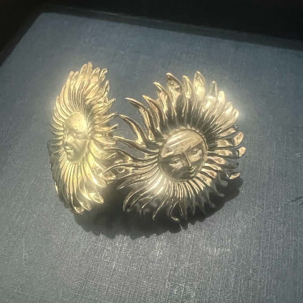 Monet Celestial Sun Face Matte and Polished silver Sunburst clipped earrings